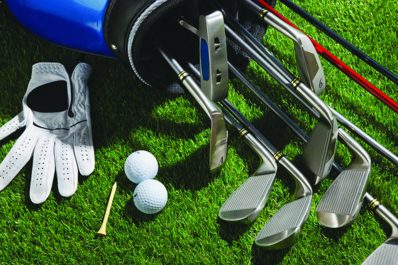 Golf clubs,balls,tee and glove